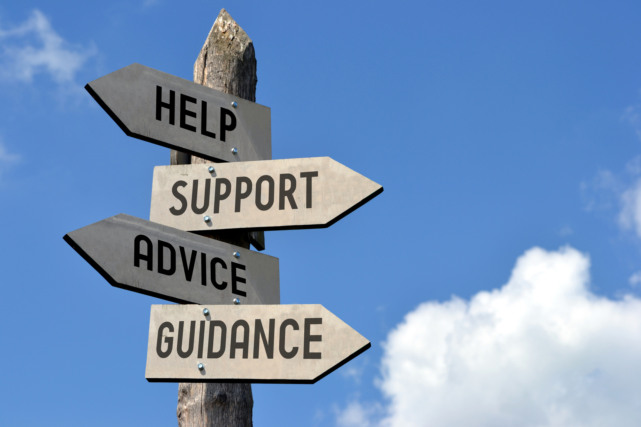 sign post with help, support, advice, and guidance words on in