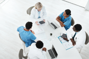 Medical professionals discussing around a table