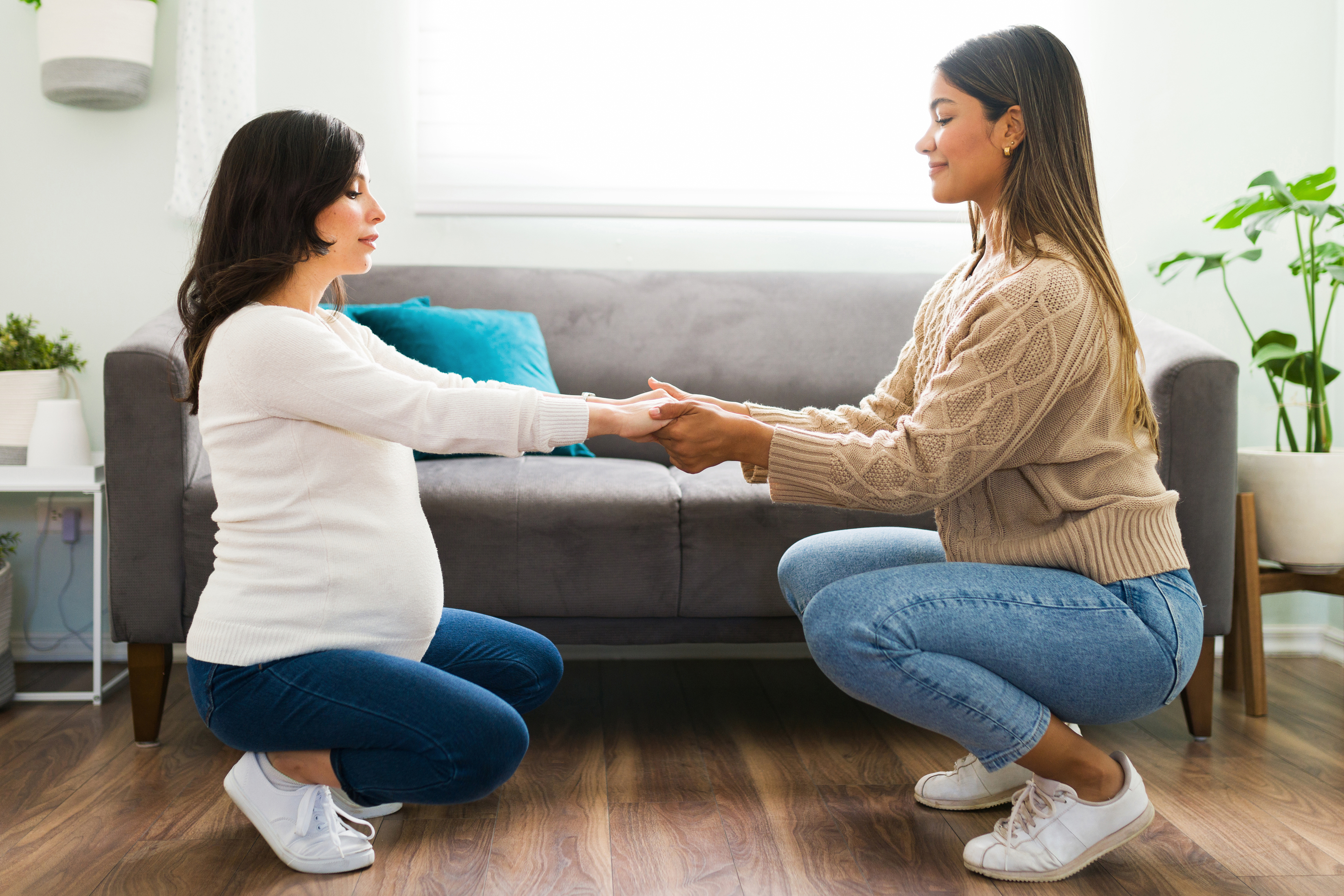 a woman doing doula labor stretches