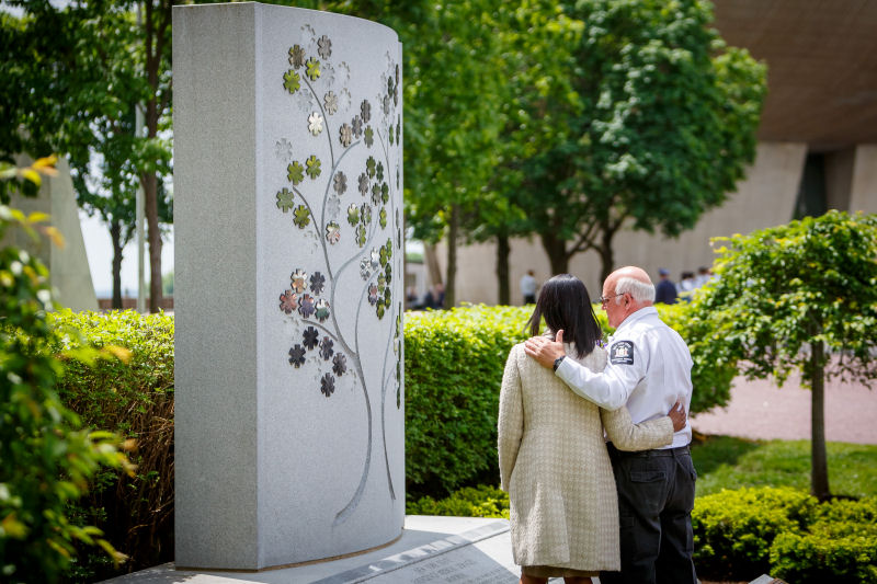 Image of attendees viewing the memorial